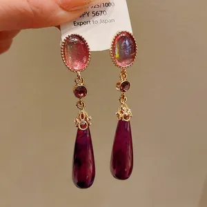 Detailed view of vintage palace style teardrop earrings with S925 sterling silver tag