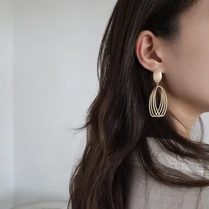 Elegant matte gold geometric hollow layered earrings for women with silver needle