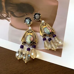 Elegant vintage palace style drop earrings with iridescent stones and clear droplets