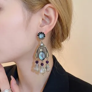 Elegant vintage palace style dangle earrings with pearls and blue teardrop crystals