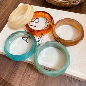 Faceted acrylic bangles with elegant marbled striped patterns in five assorted colors
