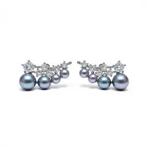Elegant 18k gold plated pearl and zircon stud earrings displayed on a white background