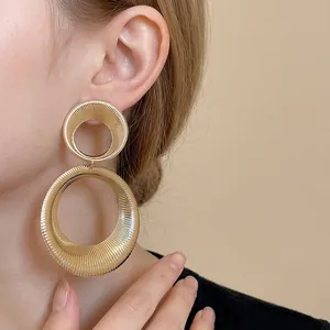 Elegant gold-toned metal double hoop drop earrings with unique ribbed texture for women