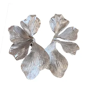 Elegant silver-tone flower petal earrings with a textured metallic finish for a chic look.