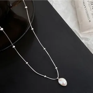 Elegant stainless steel necklace with a single Baroque freshwater pearl pendant for women
