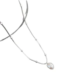 Minimalist stainless steel freshwater pearl necklace on a clean white background.