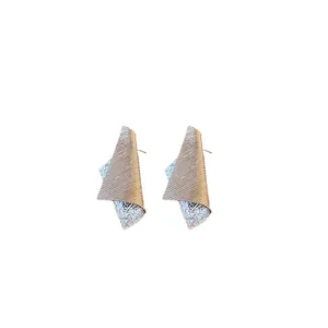 Irregular striped metal stud earrings with silver needles and textured finish for women