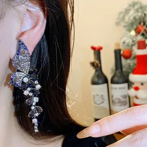 Elegant vintage silver needle butterfly wing earrings with colorful zirconia on model