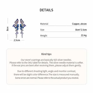 Detailed view of zircon butterfly wing earrings showing Copper material and 8cm size info