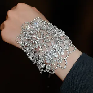 Close-up detail of sparkling rhinestone lace bracelet for elegant evening wear.
