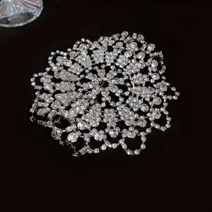 Macro view of the intricate white rhinestone pattern on the luxury evening bracelet