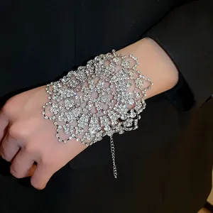Close-up of sparkling rhinestone floral pattern on wide elegant cuff bracelet