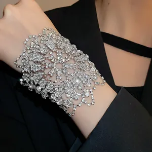 Close-up of elegant rhinestone cuff bracelet with intricate floral lace pattern