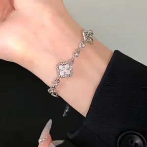 Elegant hollow flower diamond adjustable bracelet with shimmering silver finish details.
