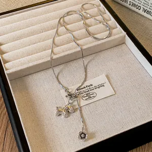 Elegant silver necklace featuring a zircon-encrusted horse pendant and flower charm