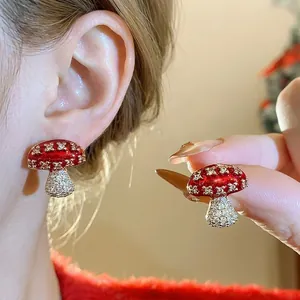 Elegant red enamel mushroom stud earrings with shimmering cubic zirconia accents
