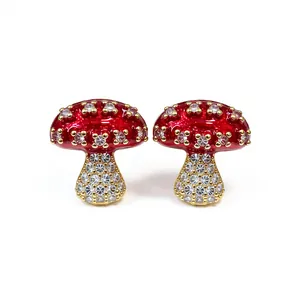 Exquisite red enamel mushroom stud earrings set with sparkling cubic zirconia crystals