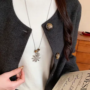 Vintage tiger eye beaded flower pendant necklace on a silver long sweater chain for women