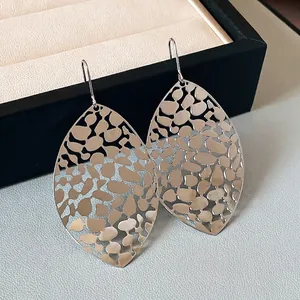 Large hollow metal leaf dangle earrings with minimalist geometric design