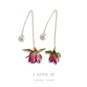 Elegant handmade earrings with real eternal rosebuds and pearls on 925 silver needles