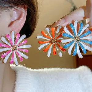 Large colorful enamel daisy flower stud earrings with elegant gold-tone metal accents