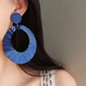 Large oval denim fabric wrapped hoop earrings with silver pins for women fashion jewelry.