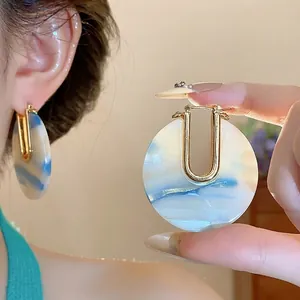 Vintage 18k gold plated acetate U-shaped hoop earrings with blue marble pattern