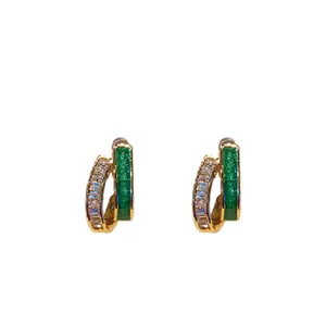 Gold-plated hoop earrings with sparkling zircon and green enamel in a geometric design.
