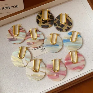 Variety of vintage acetate U-shaped hoop earrings with colorful marbled patterns