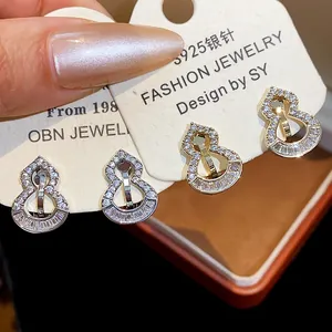 Exquisite close-up of 18k gold plated zircon gourd ear clips for non-pierced ears
