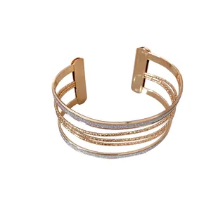 Elegant rose gold multi-layer open cuff bracelet with sparkly silver glitter accents