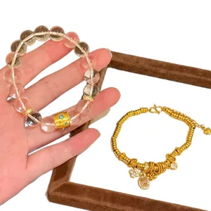 Elegant gold-plated bracelet set with crystal beads and zircon flower charms.