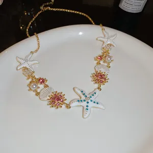 Detailed view of ocean-themed necklace featuring starfish, sea shells, and pearls