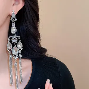 Close-up detail of silver needle tassel earrings featuring exquisite water drop rhinestones