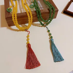 Elegante lange Perlenhalskette im neuen chinesischen Stil mit bunten Quasten für Damen