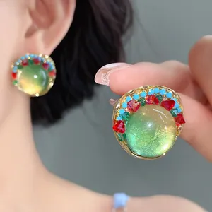 Close-up of French retro palace style round resin earrings with vibrant colorful beads.
