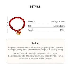 Detailed view of red agate bracelet with golden rutile quartz and rocking horse charm