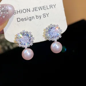 Elegant flower-shaped zircon and pearl stud earrings with silver needles