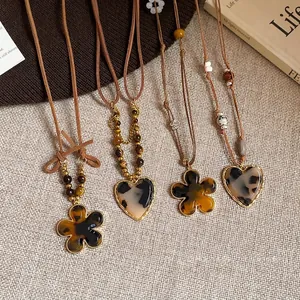 Elegant Maillard style tiger eye stone flower and heart pendant sweater chain necklaces