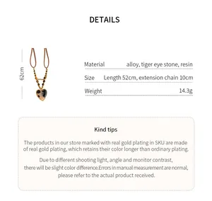 Detail view of tiger eye stone heart necklace with materials and size specs