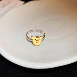 Bague argentée ajustable avec personnage de dessin animé Pompompurin sur assiette