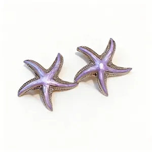 Elegant lavender enamel starfish stud earrings with silver finish for a beach aesthetic.