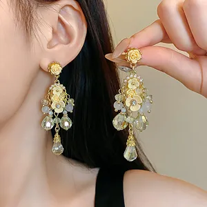 Exquisite detail view of floral chandelier earrings featuring crystals and pearls