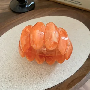 Bracelet chic en résine marbrée orange vif avec un design géométrique unique pour femmes