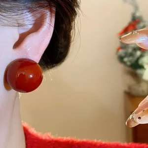 Elegant dark red resin ball stud earrings with silver needles for a stylish festive look