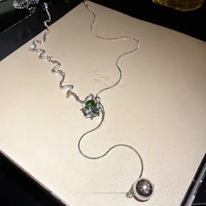Elegant silver tassel necklace with green square zircon pendant and metal ball dangle
