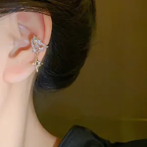 Detailed view of a sparkling zircon four-pointed star ear cuff for non-pierced ears.