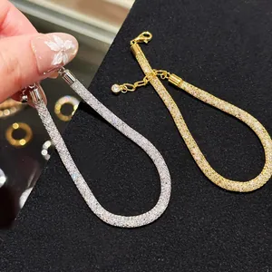 Detailed view of elegant French style mesh bracelets filled with sparkling zircons