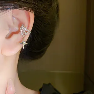 Close-up of sparkling zircon star ear cuff showing intricate diamond-like details