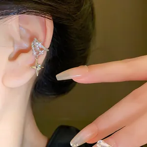 High-detail macro shot of a shimmering zircon star ear cuff worn on a human ear